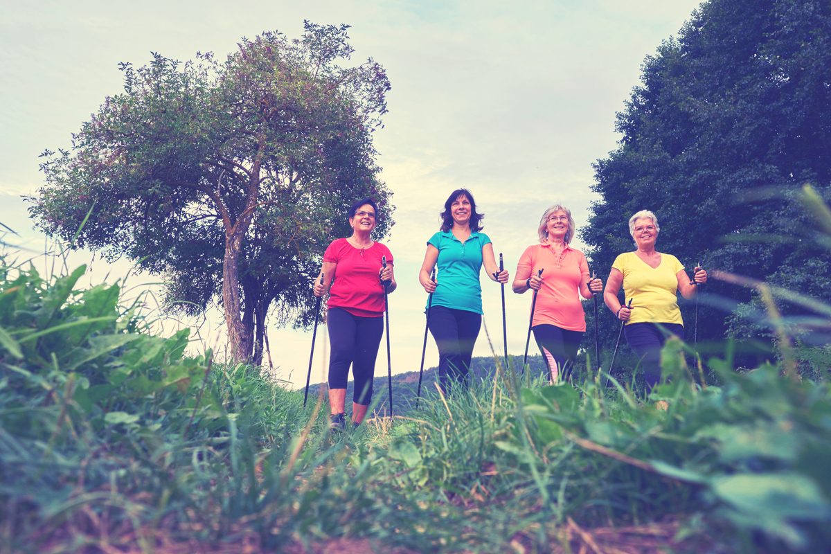 Four women walking outside for exercise.