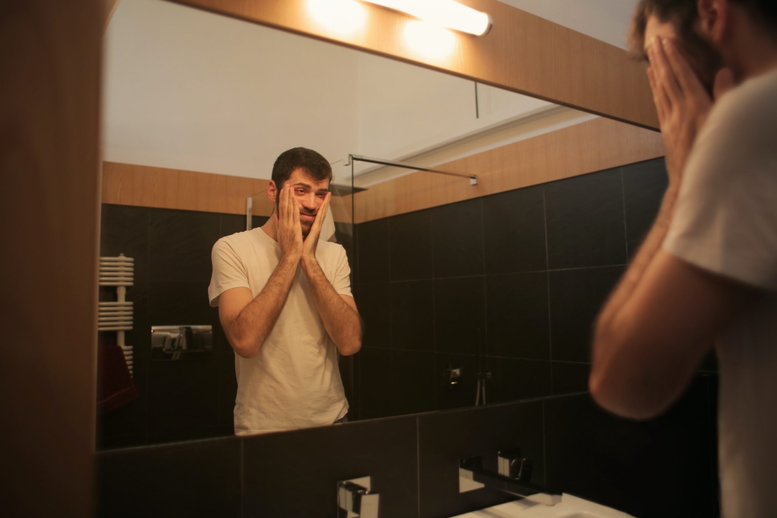 Anxious Man Looking in the Mirror