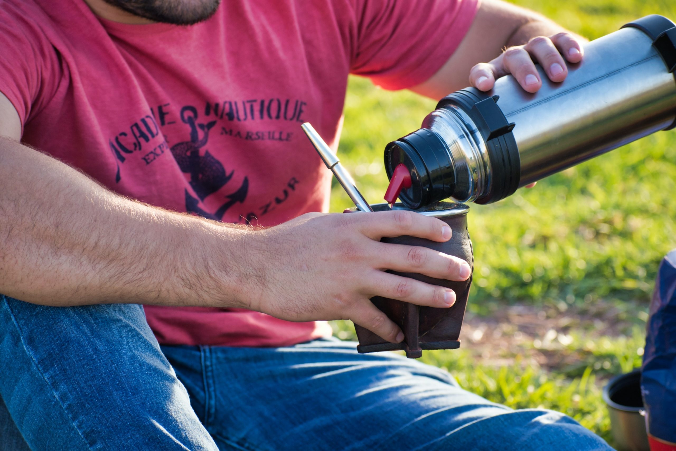 Man Drinking from Thermos