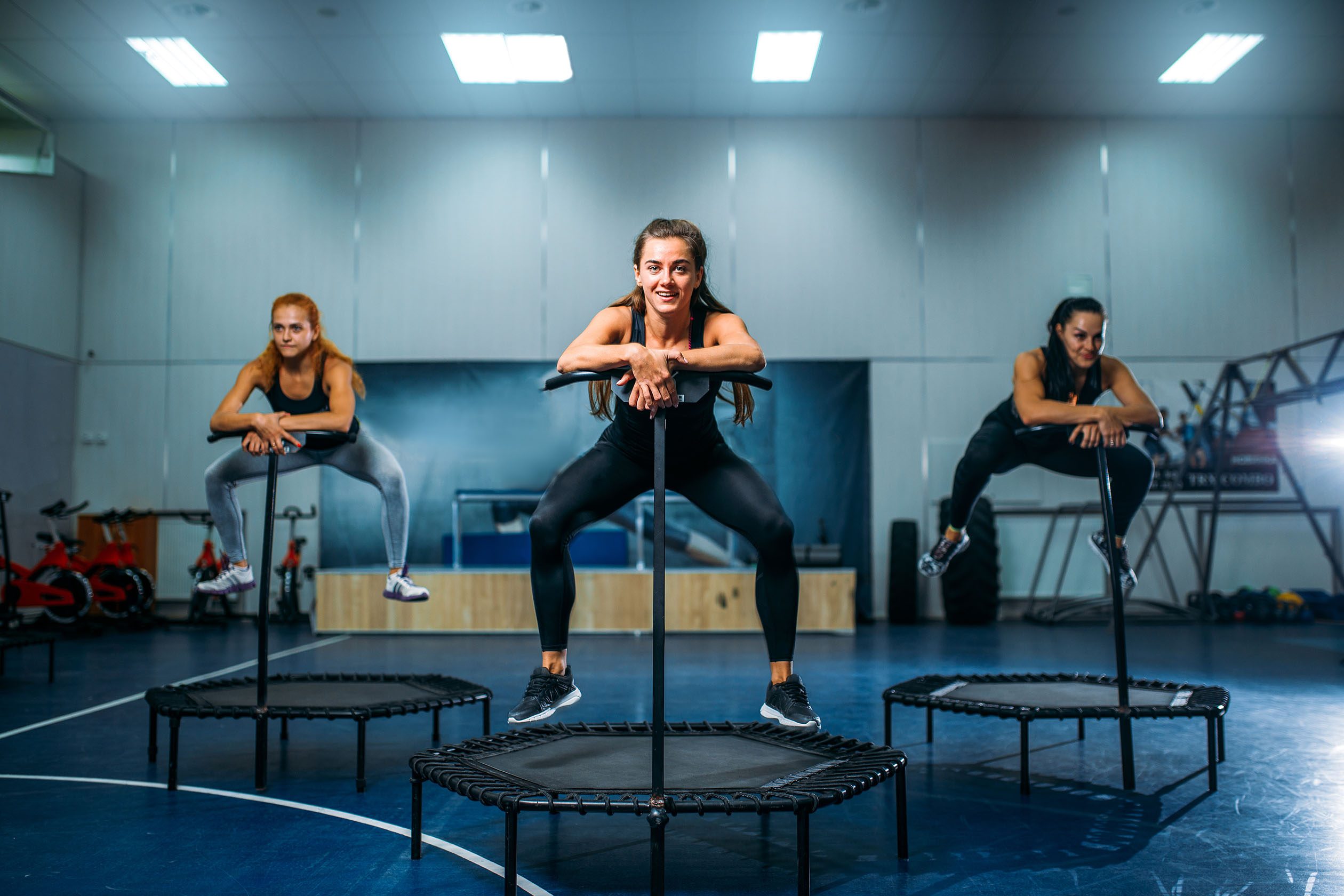 women jumping on trampolines