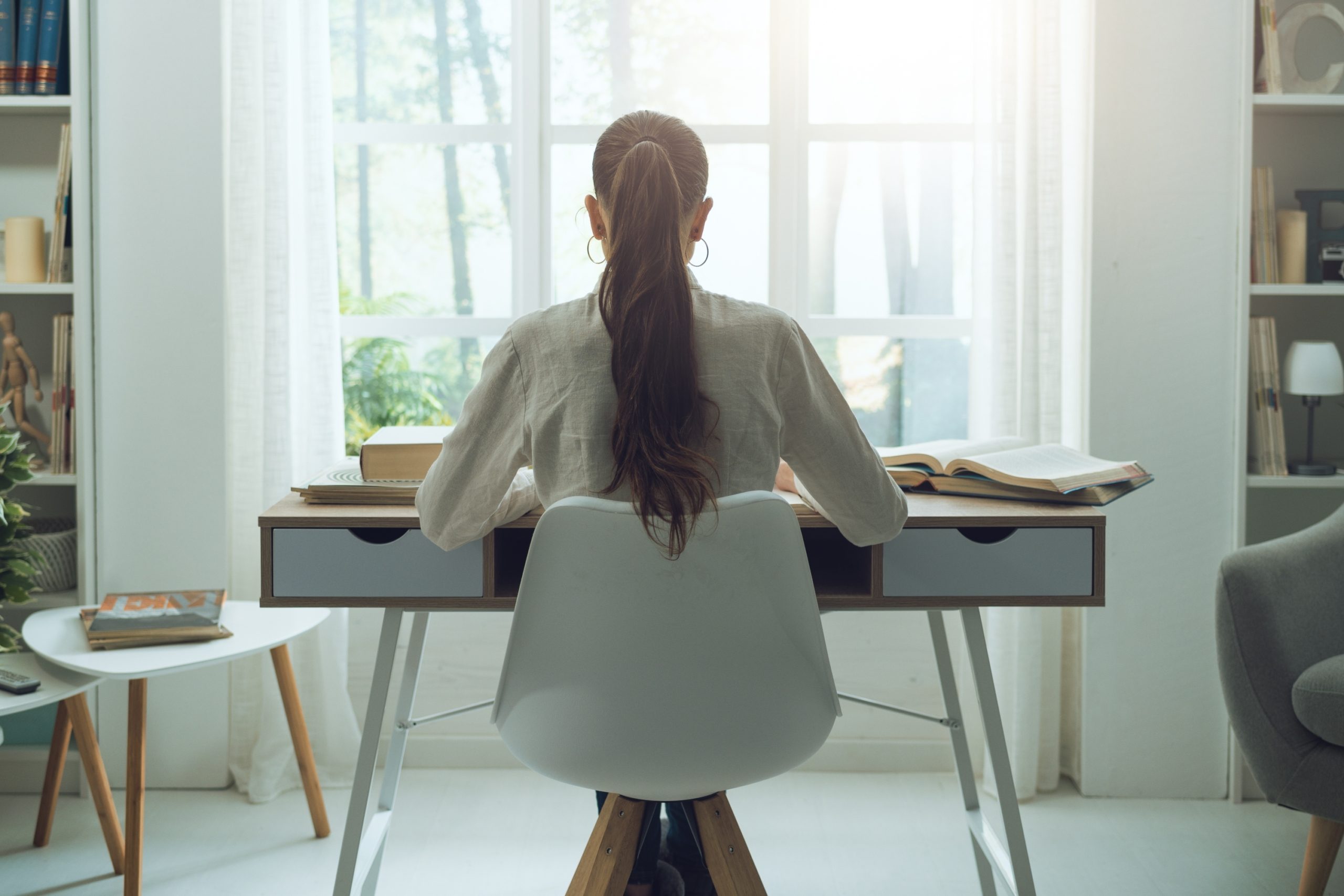 woman sitting a desk at home