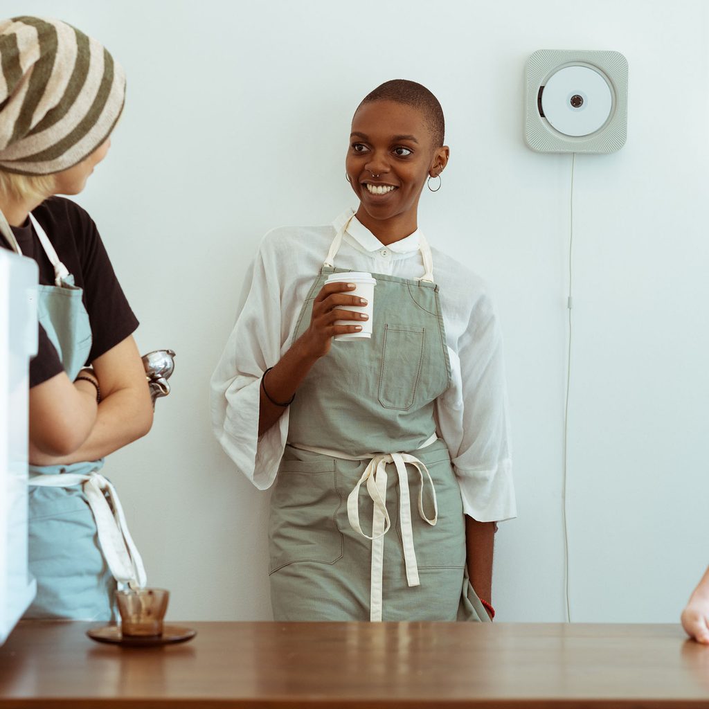 Coworkers engaging in small talk at work