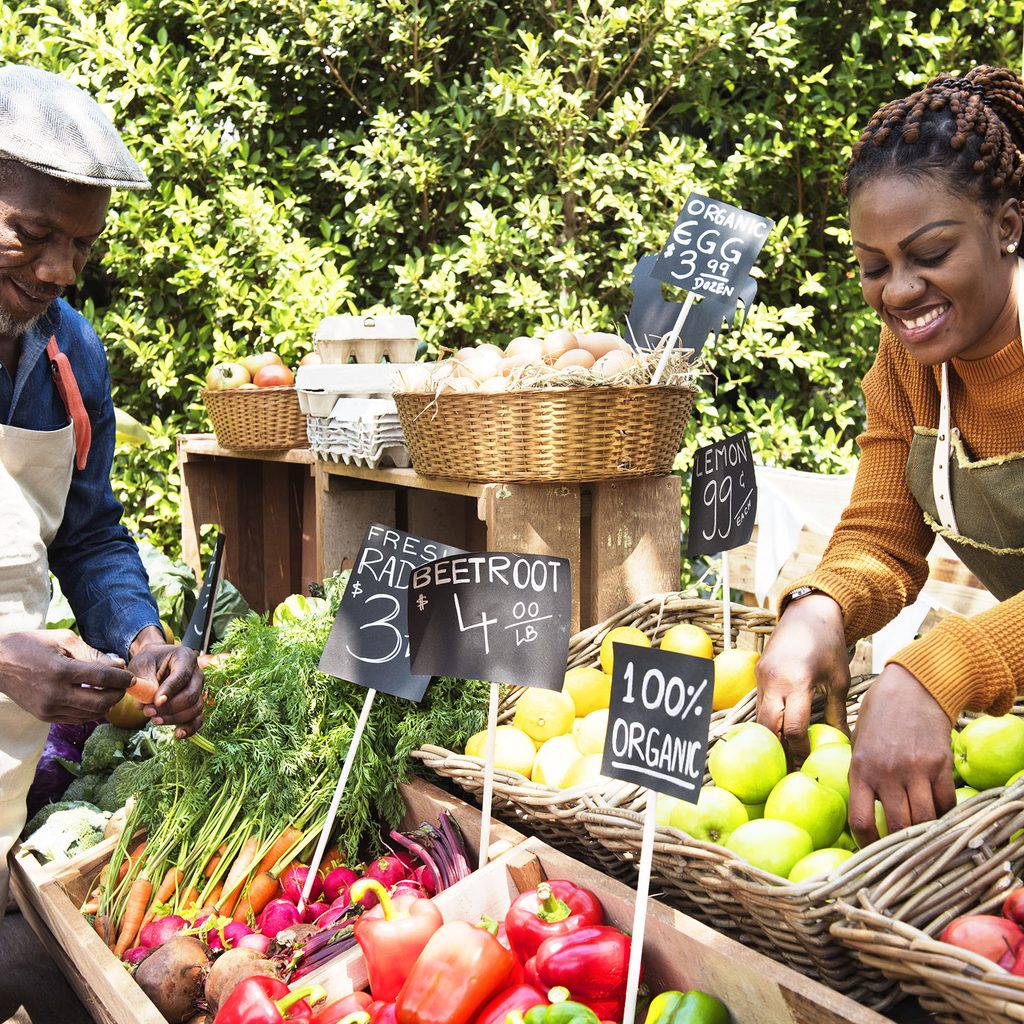 Black couple working at a farmers market