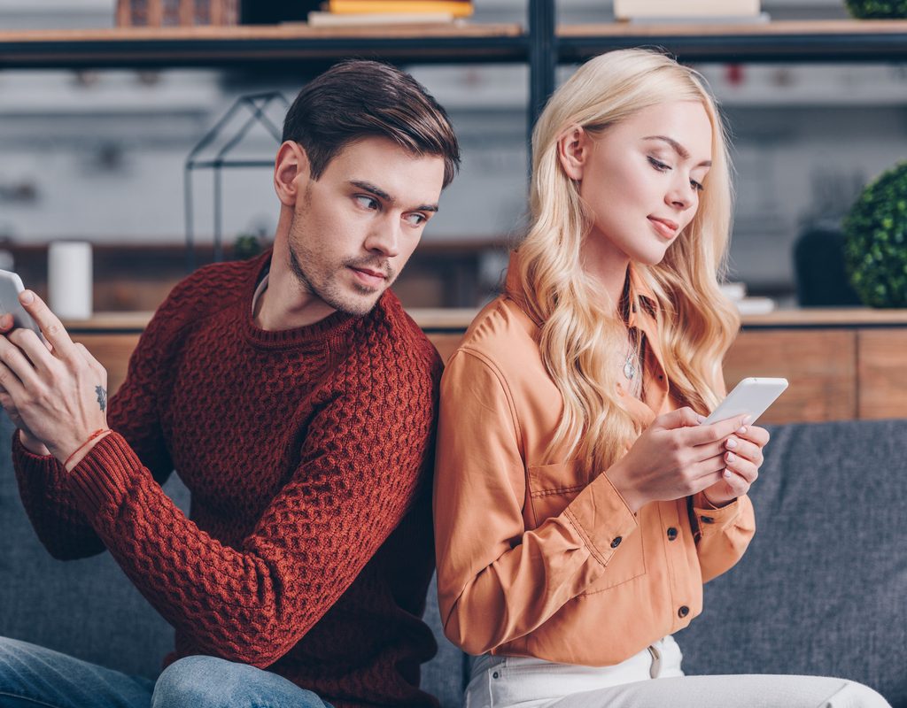 A jealous couple on their phones