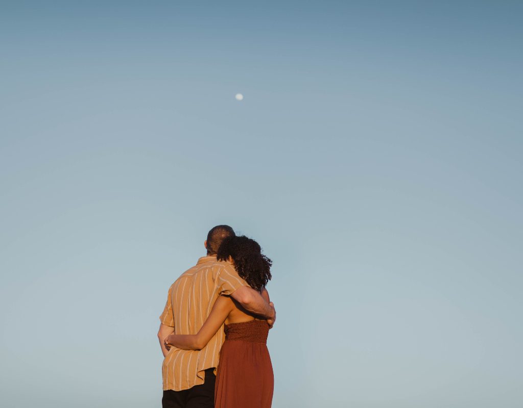 Couple looks at the moon