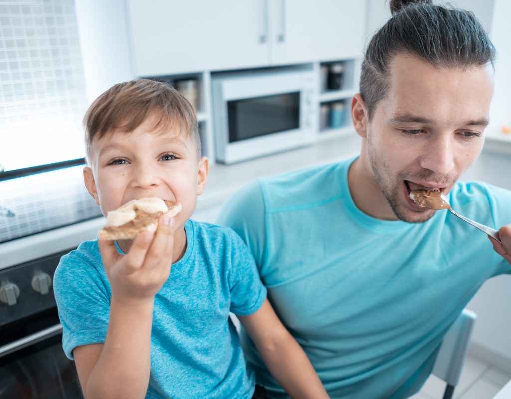 A father and son eat no-nut butter