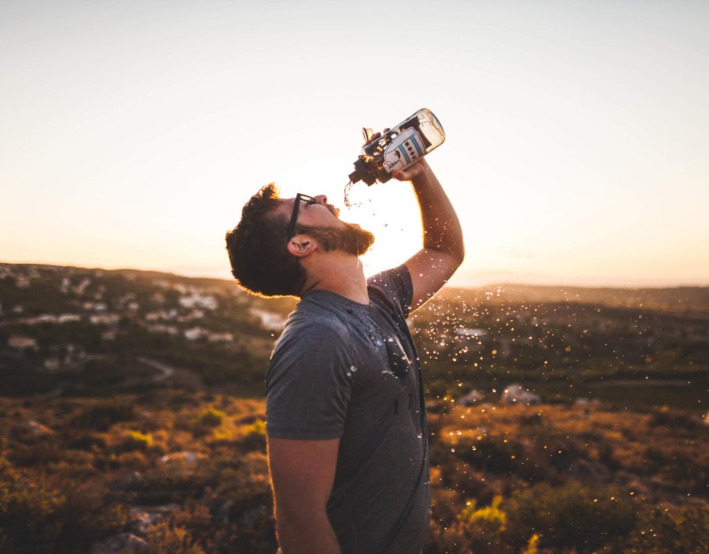 A man drinks coconut water
