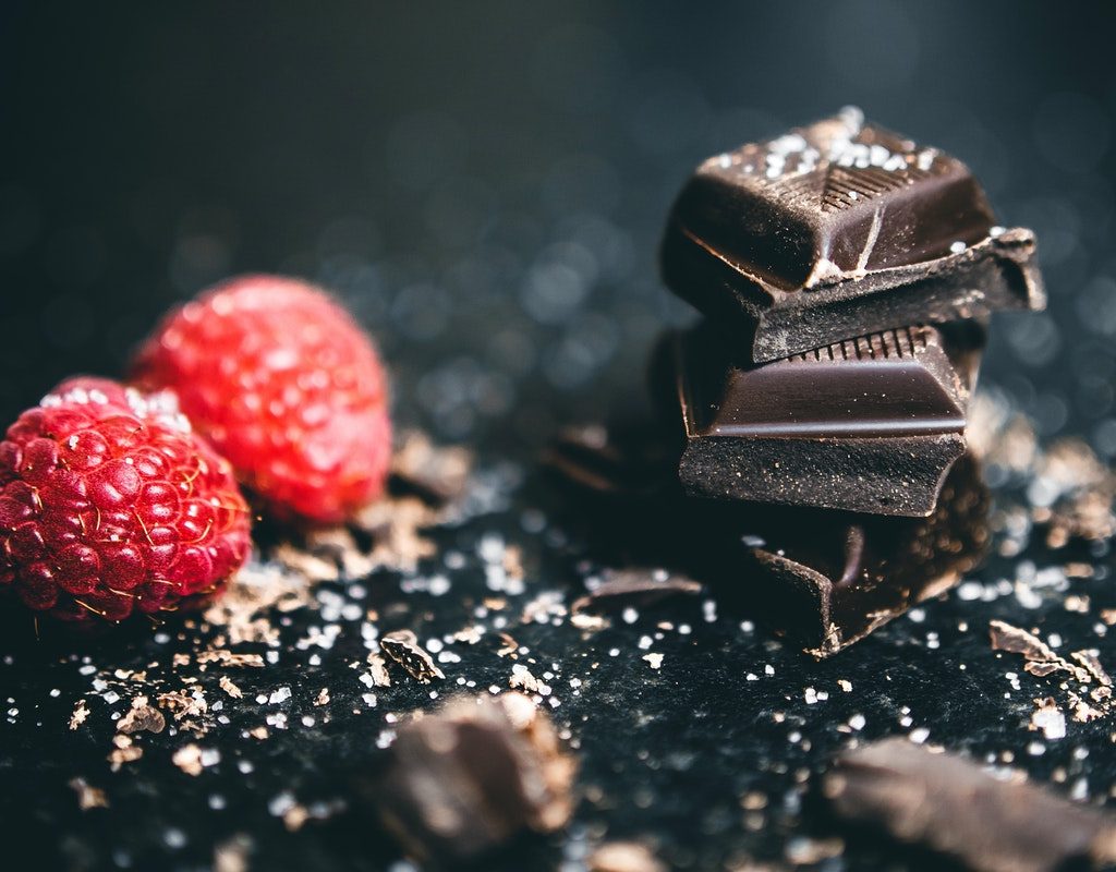 berries and dark chocolate on a table
