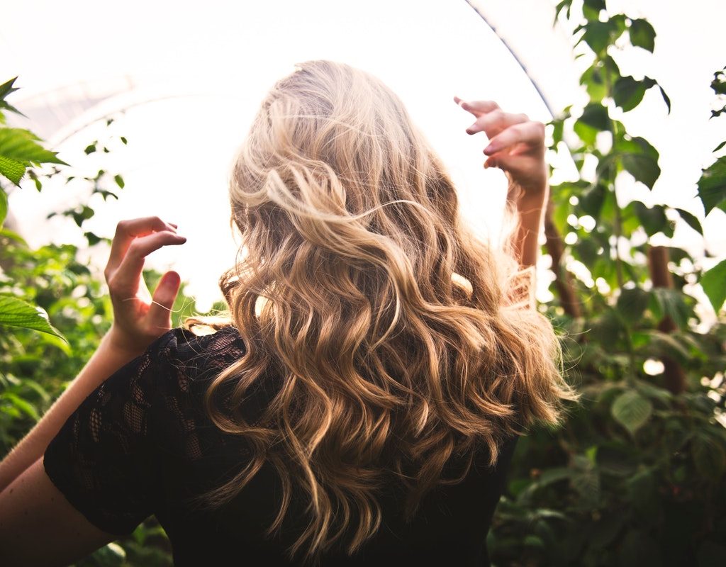 The back of a gorgeous head of wavy hair