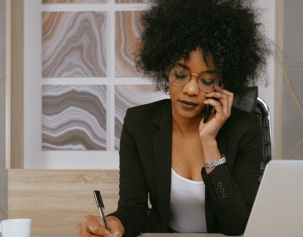 woman-on-phone-taking-notes-therapy