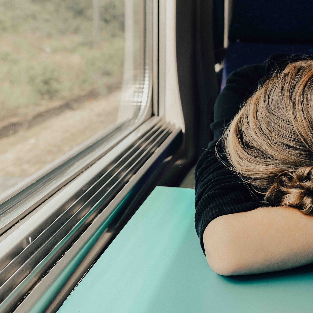 Woman sleeping on a train