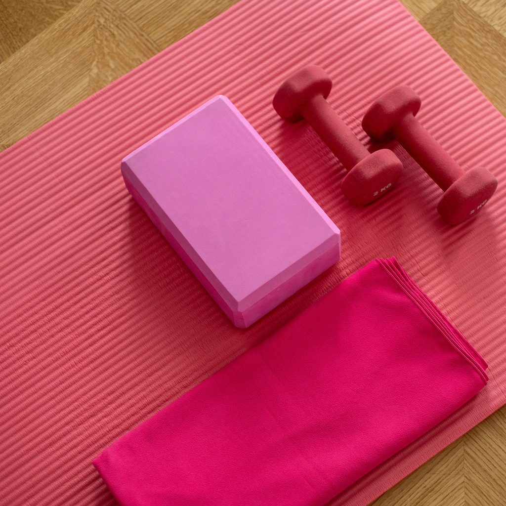 Yoga mat, block, and weight for a home workout