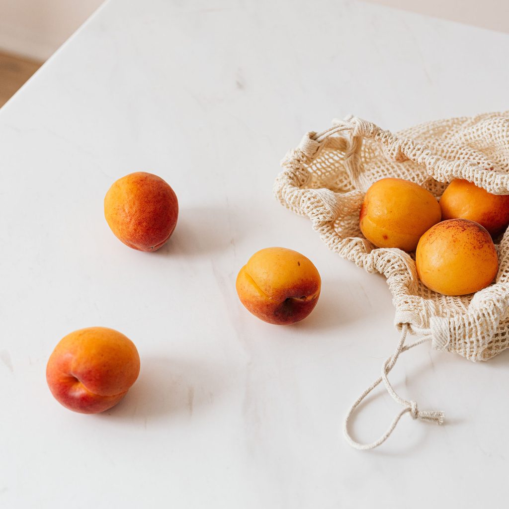 Apricots in a reusable shopping bag