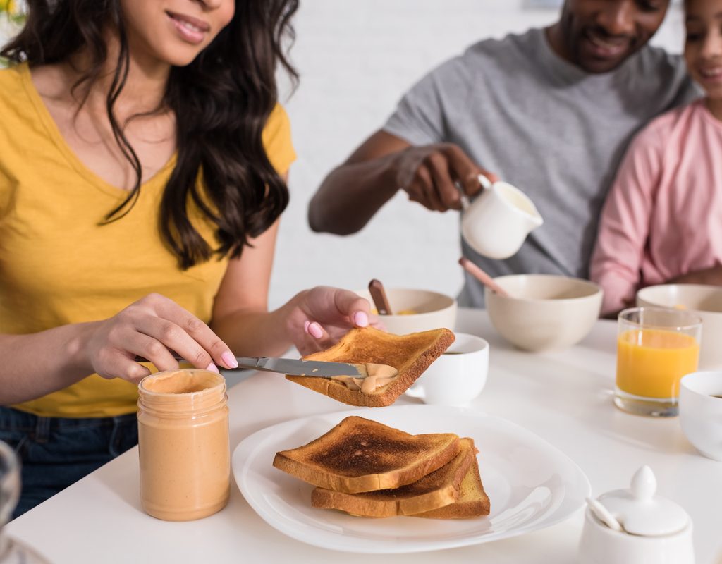 A family eating peanut butter