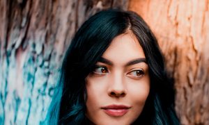 A young woman with naturally glowing skin.