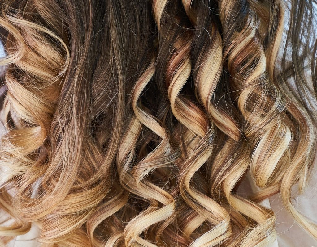 Back of a head of highlighted hair.