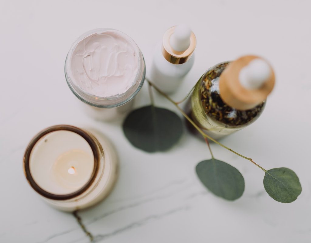 Beauty products laid out on a table.