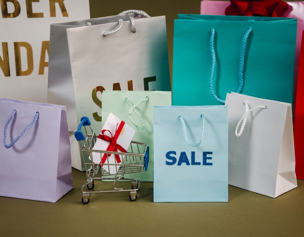 A bunch of shopping bags on a table.