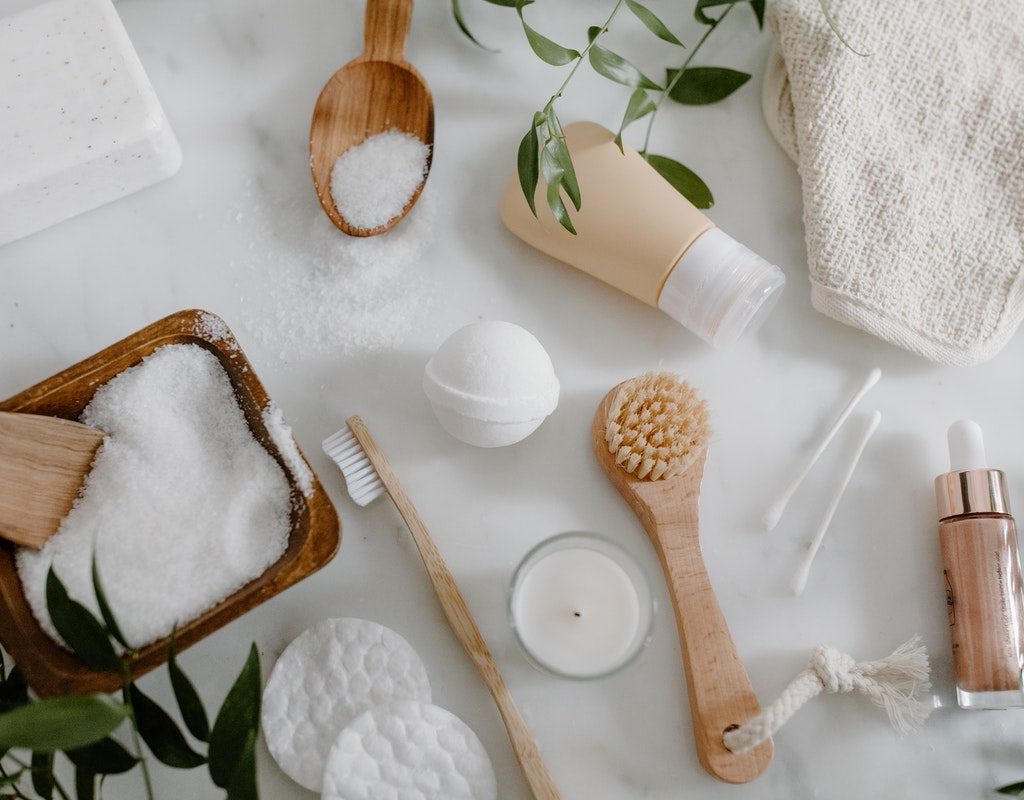 Various body exfoliating tools laid out on a table.