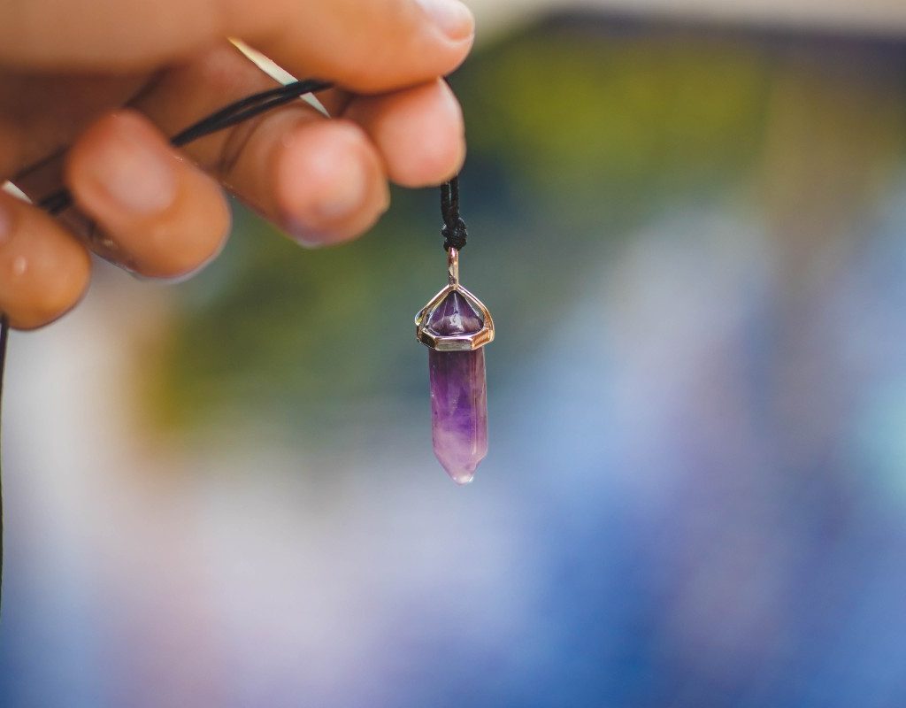 woman-holding-necklace