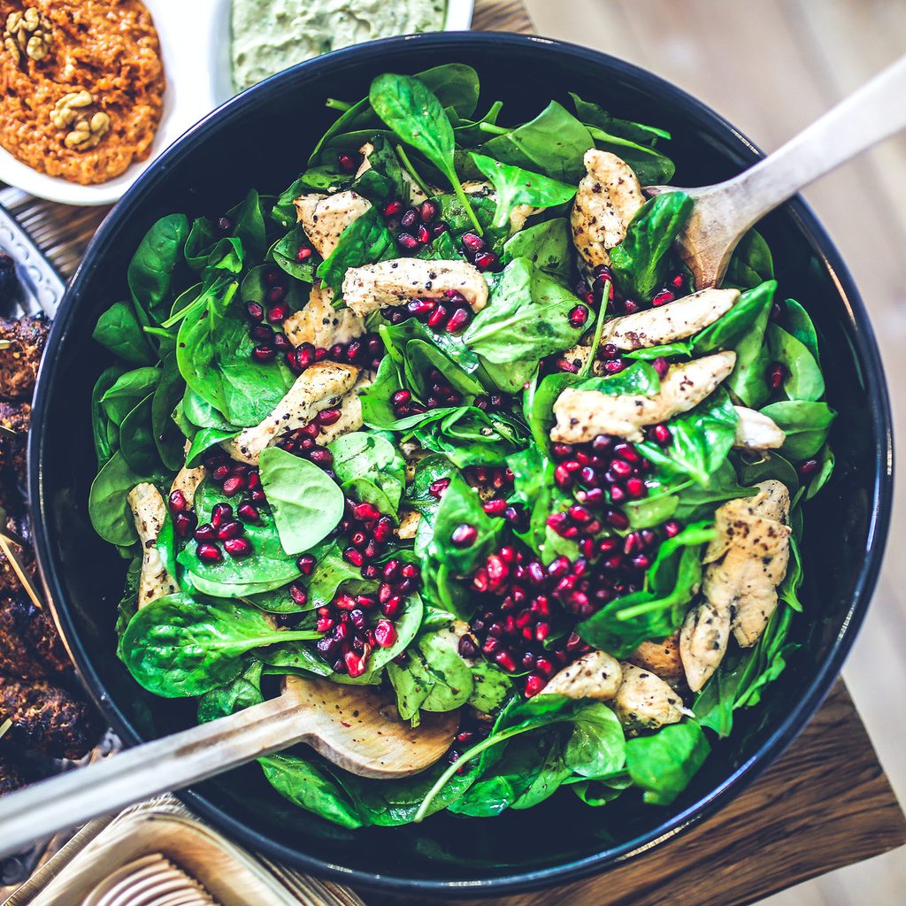Spinach, chicken, and pomegranate salad