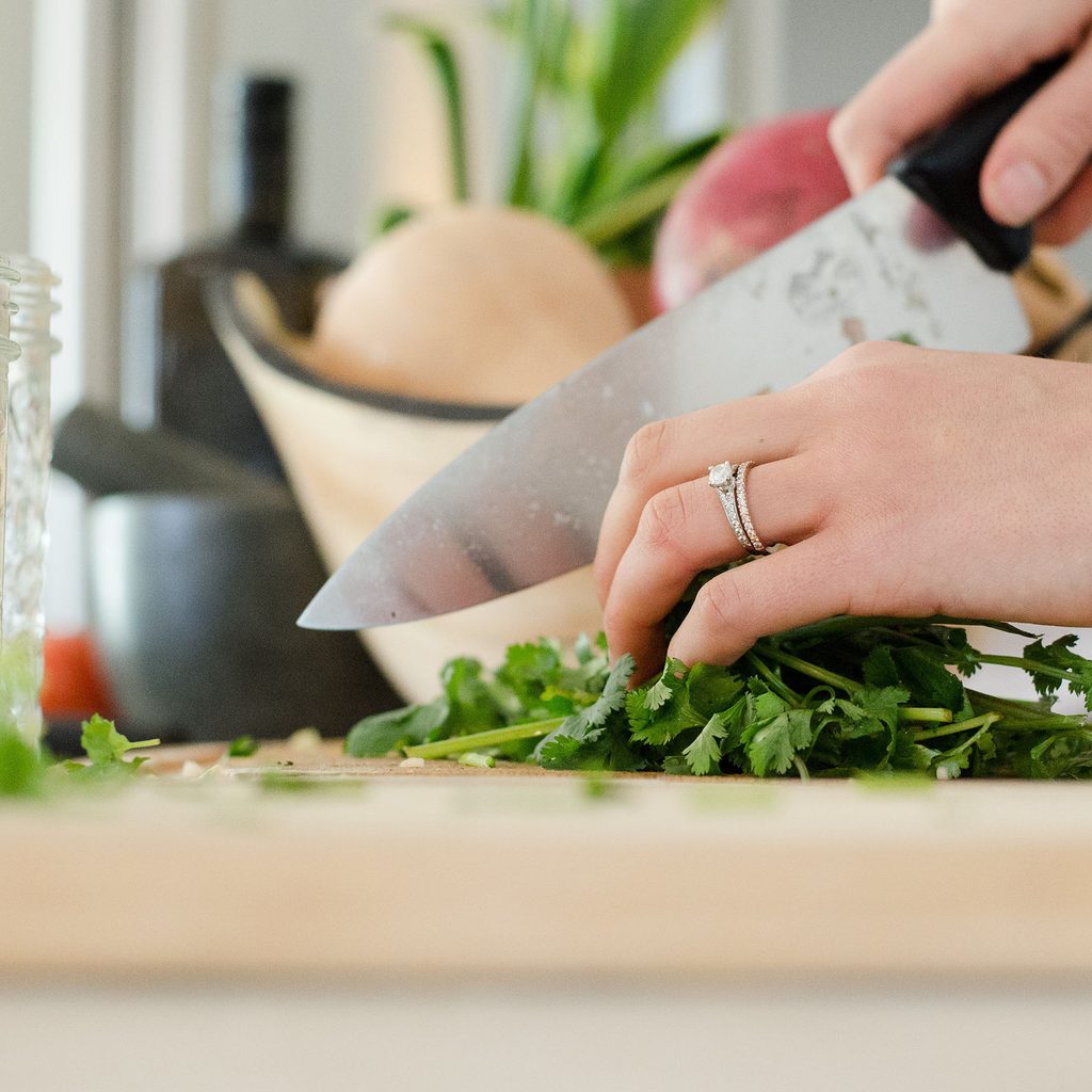 Woman chopping herbs