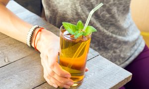 A woman drinking kombucha