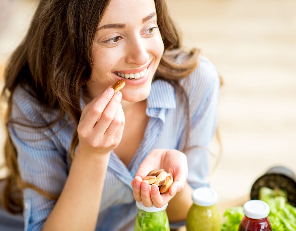 A woman eating nuts