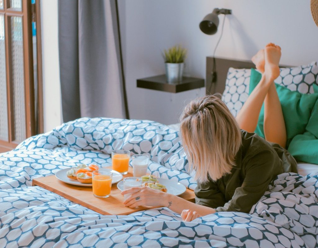 woman-practicing-self-care-in-bed