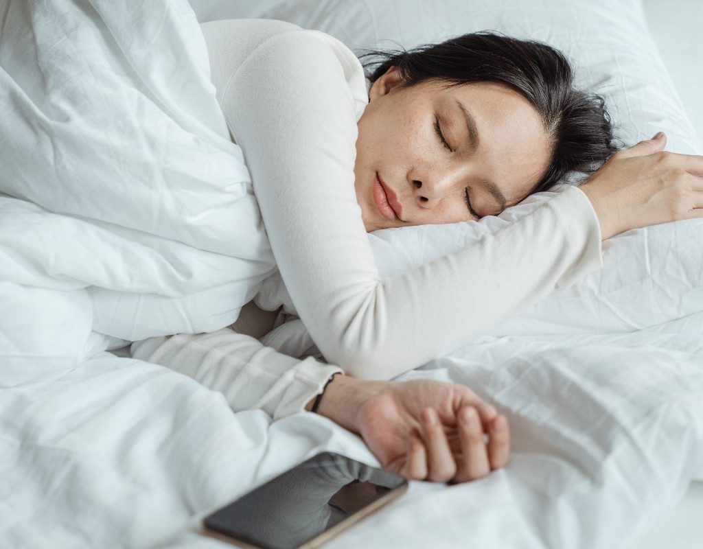 woman-sleeping-with-phone