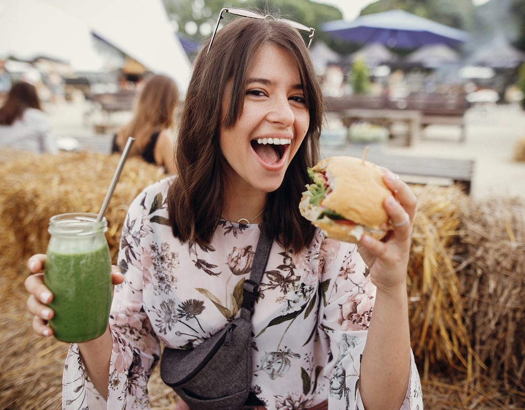 A woman eating vegan protein