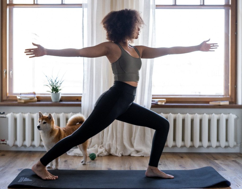 woman-yoga-at-home-with-dog
