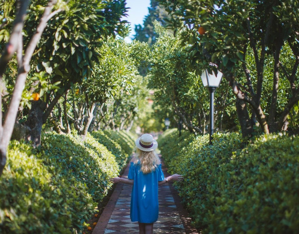 blonde-woman-walking-through-park