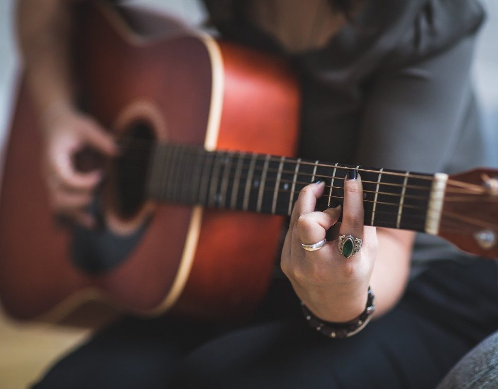 hands-of-guitar-playing-woman