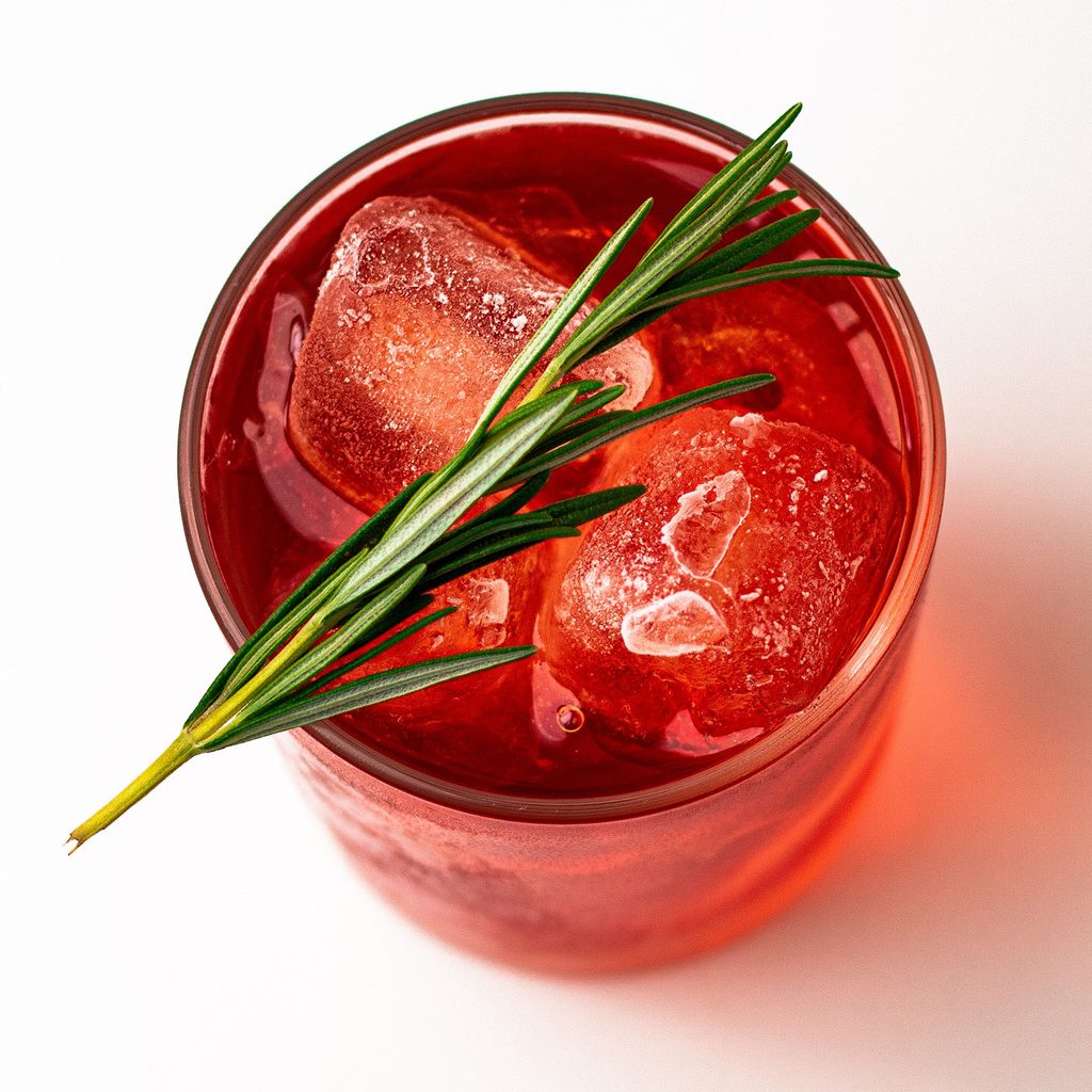 Negroni with rosemary garnish