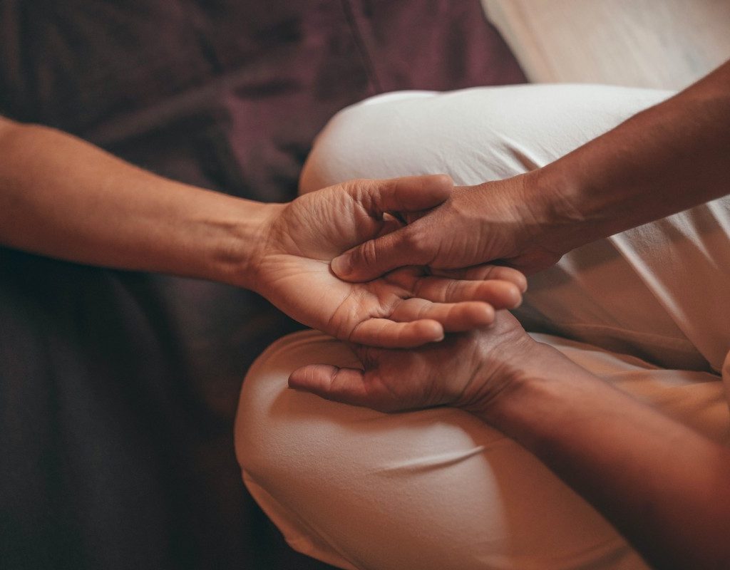 person-receiving-hand-massage