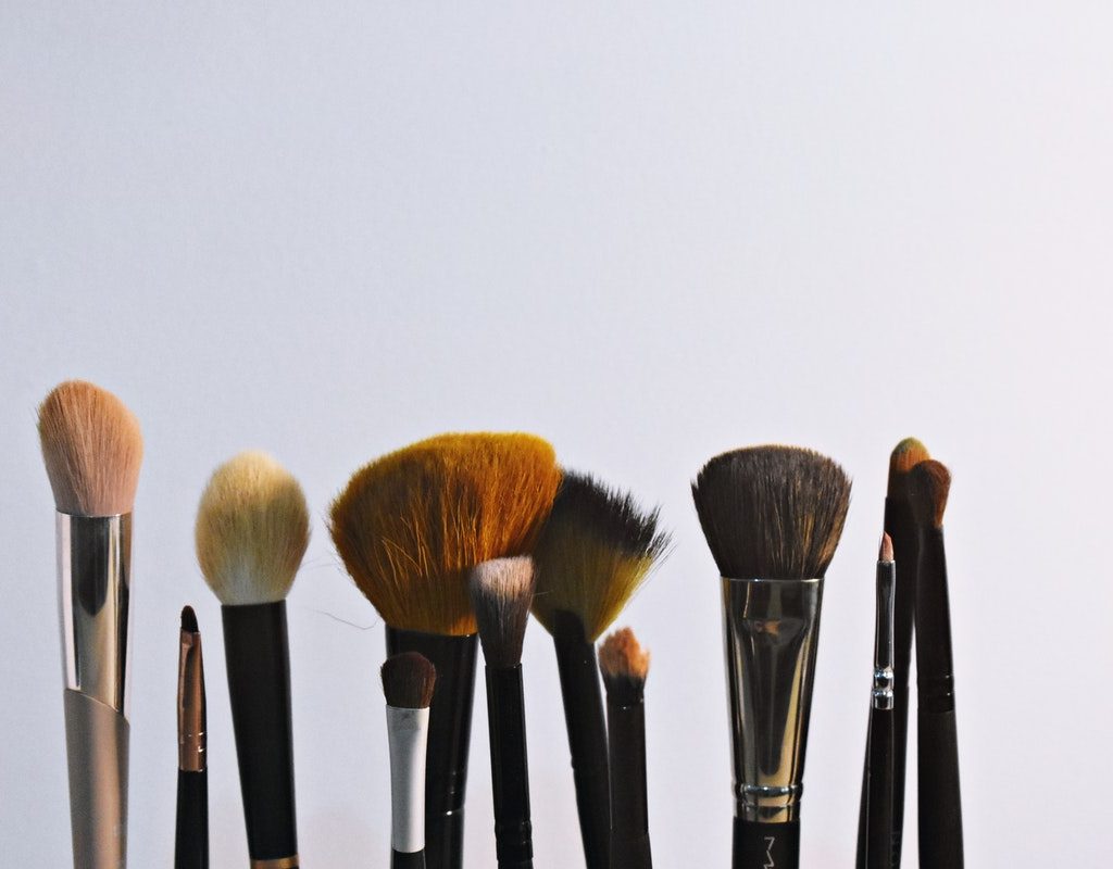 A row of makeup brushes.