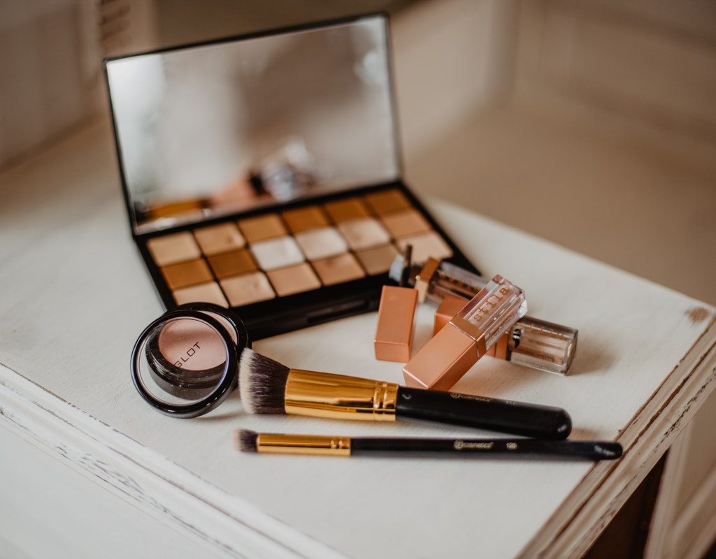 Various makeup products on a table.
