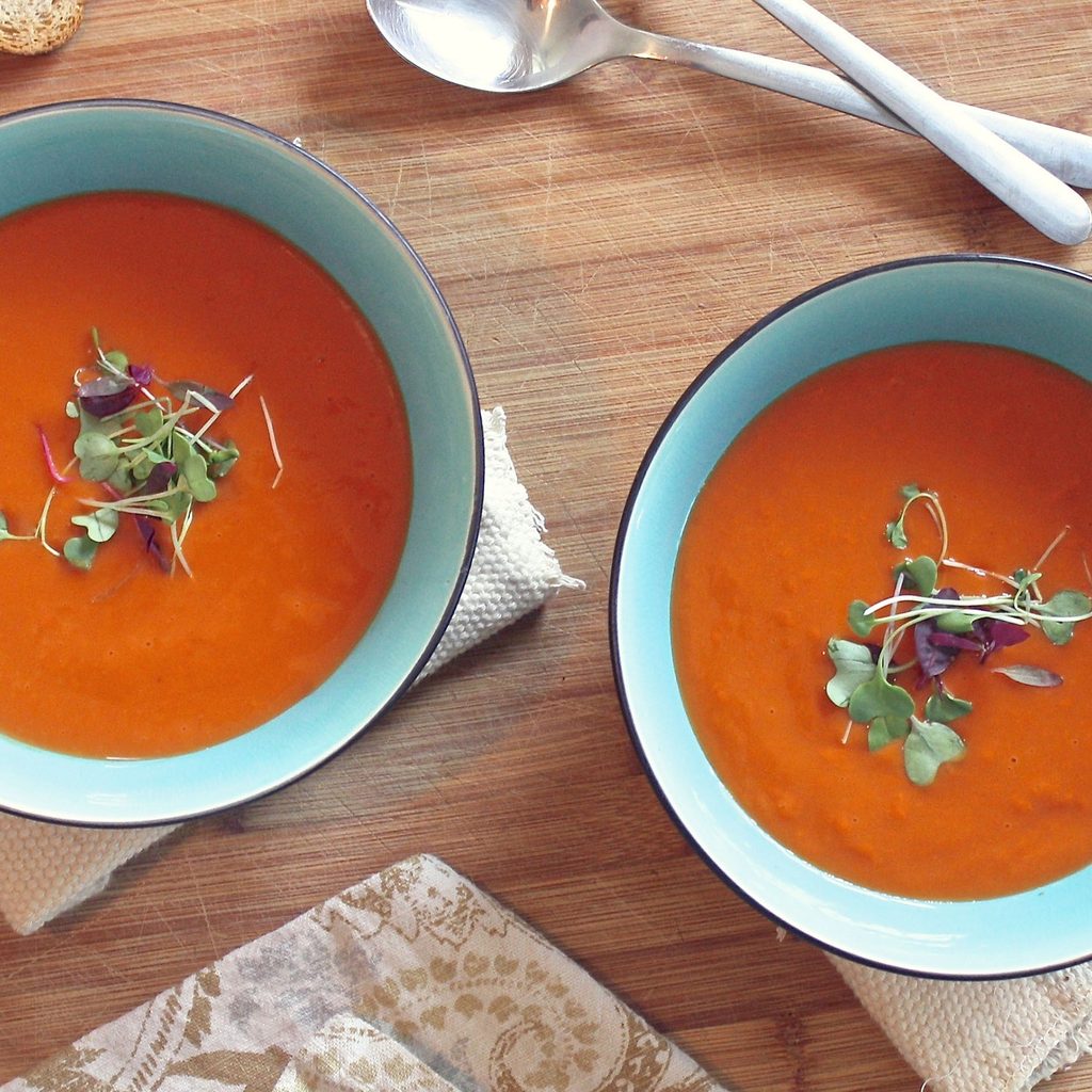 Two bowls of red soup