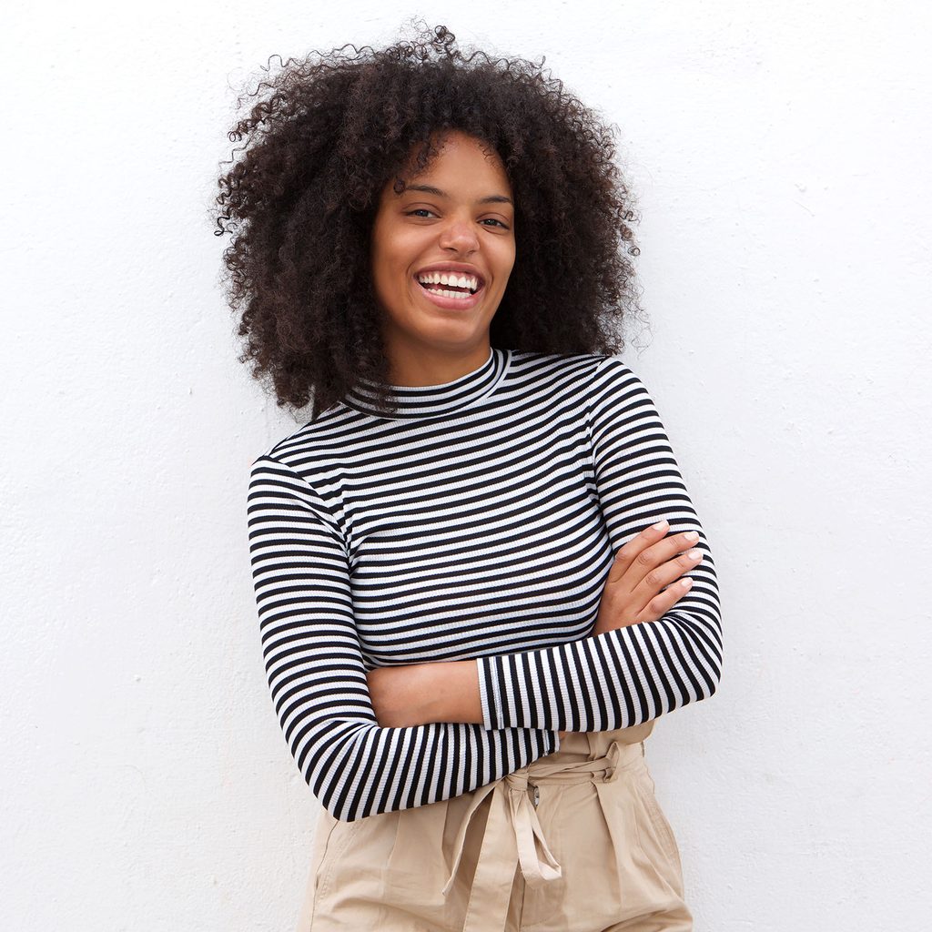 Smiling woman wearing black and white stripes