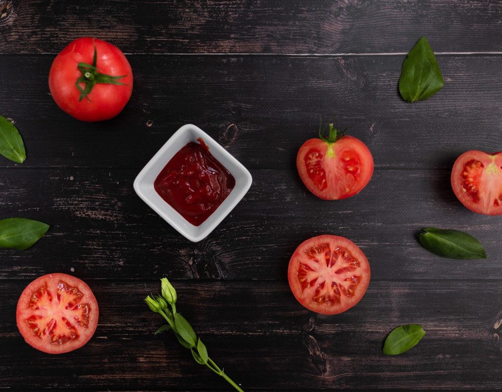 tomato-and-ketchup-on-dark-wood