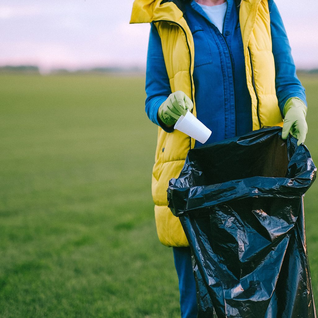 Volunteer picking up trash