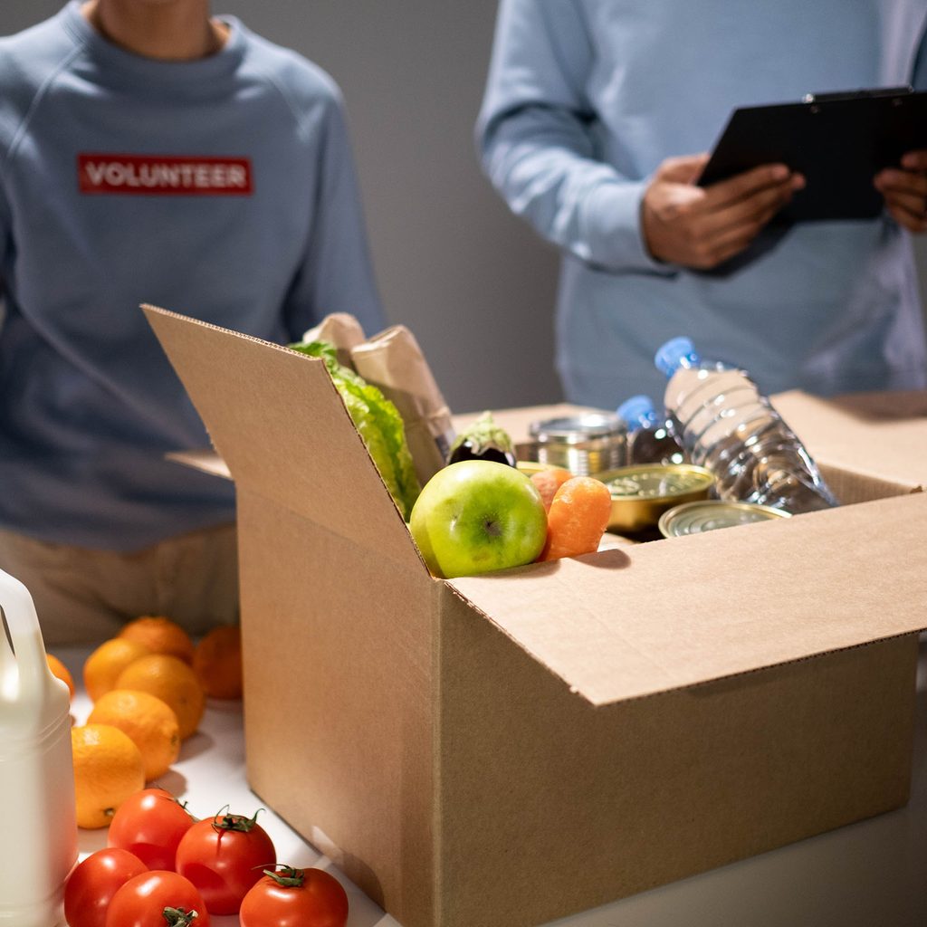 Volunteers packing food donations