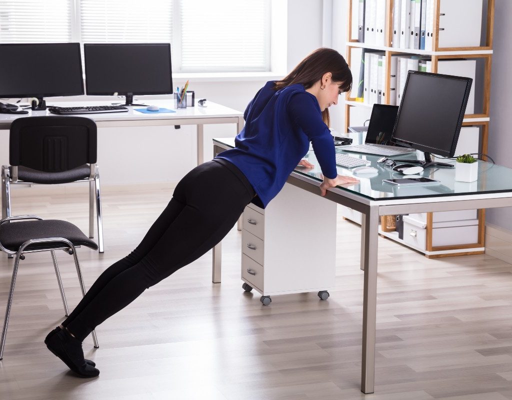 woman-doing-desk-pushup