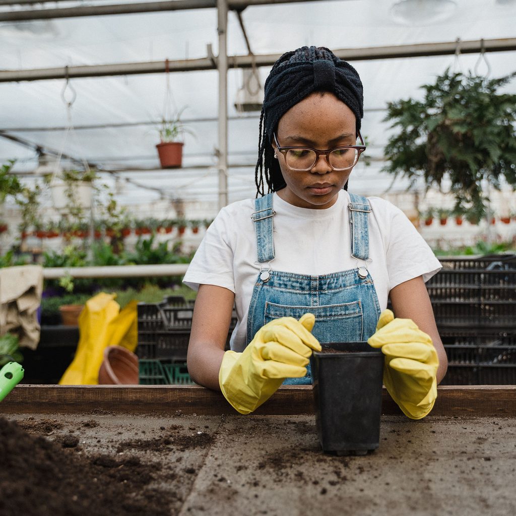 Woman preparing pots for plants