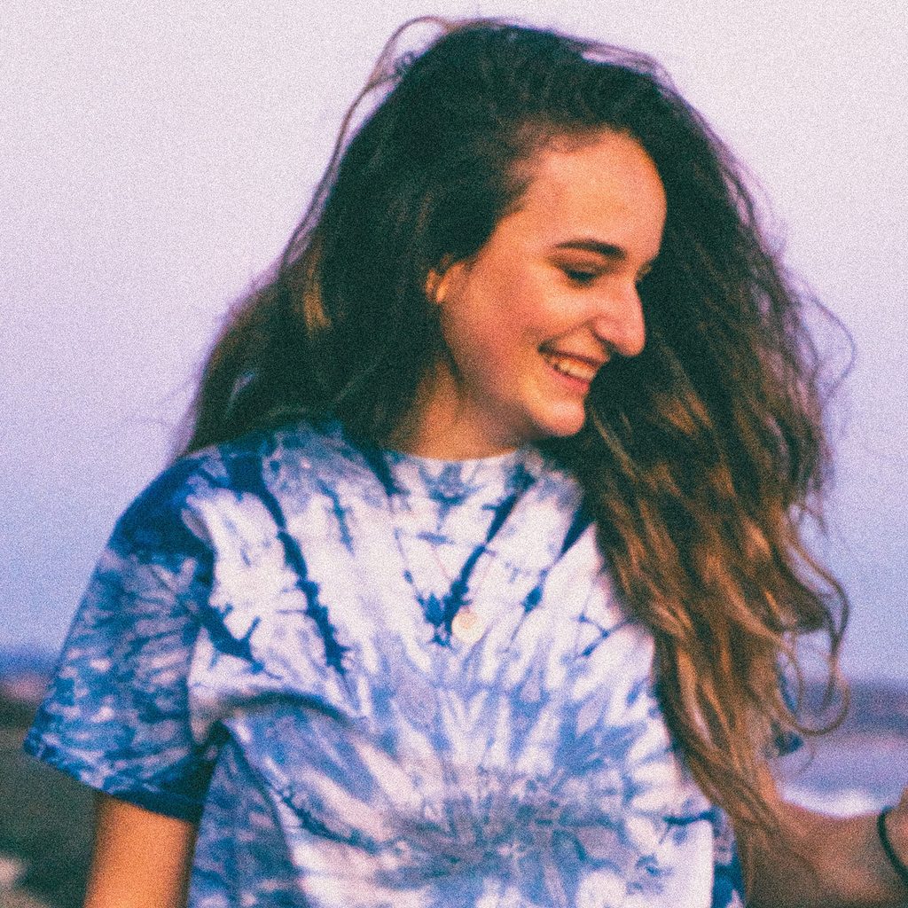 Woman wearing a blue and white tie dye shirt