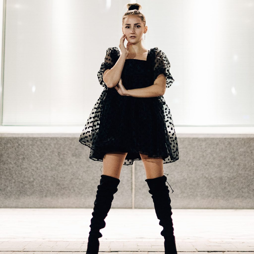 Petite woman in over-the-knee boots