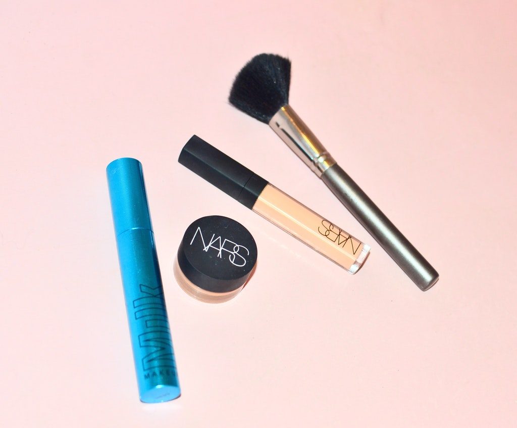 Some foundation makeup set on a table.