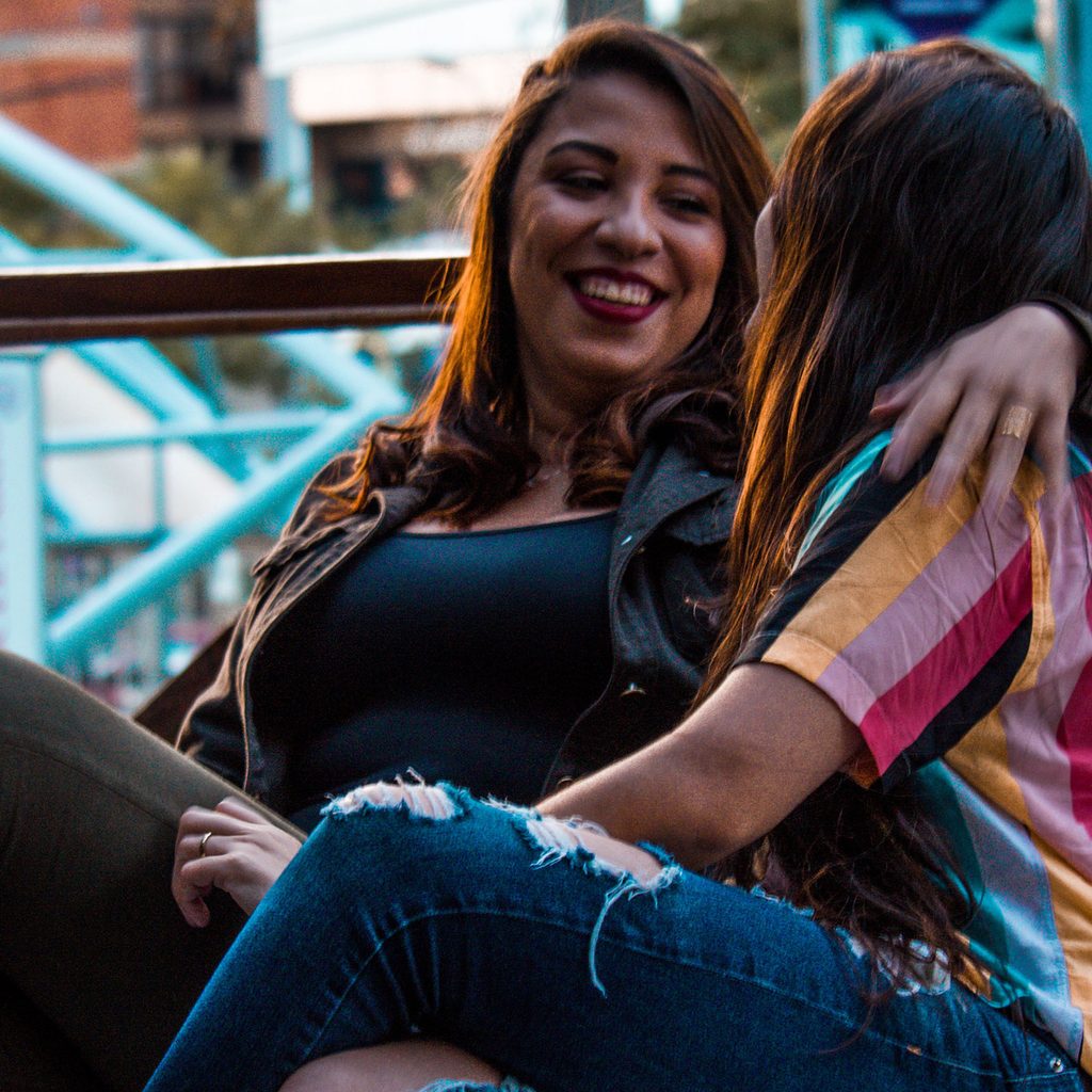 Two women sitting on a bench