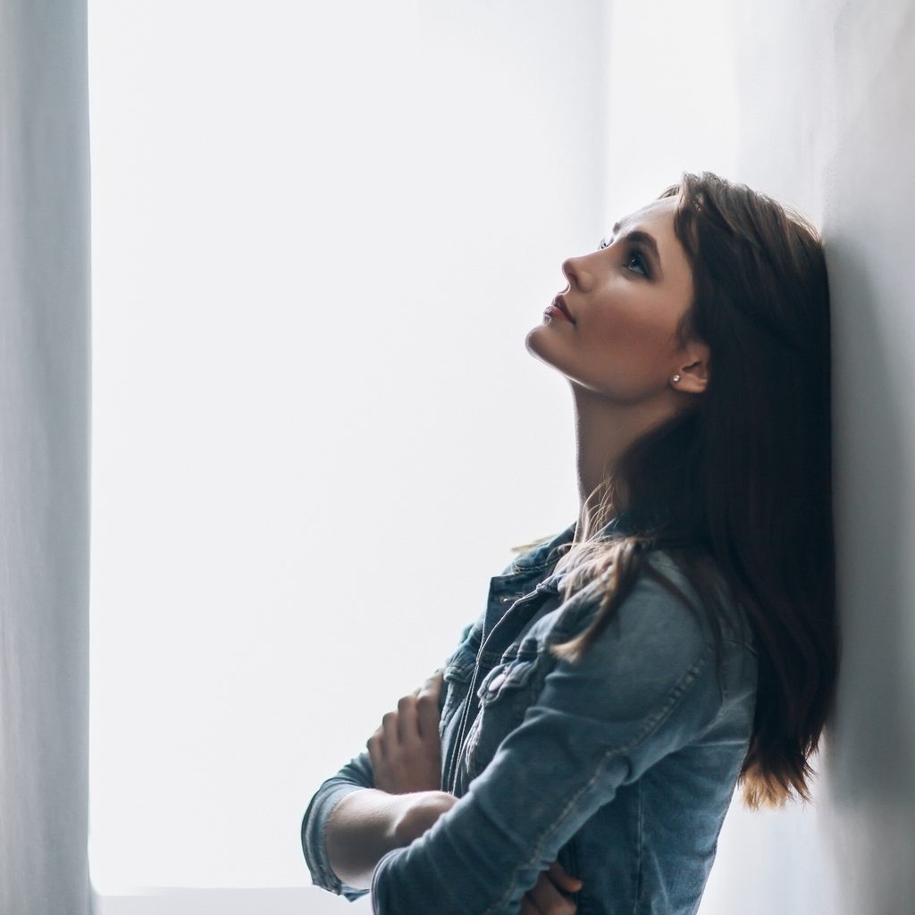 woman leaning against wall